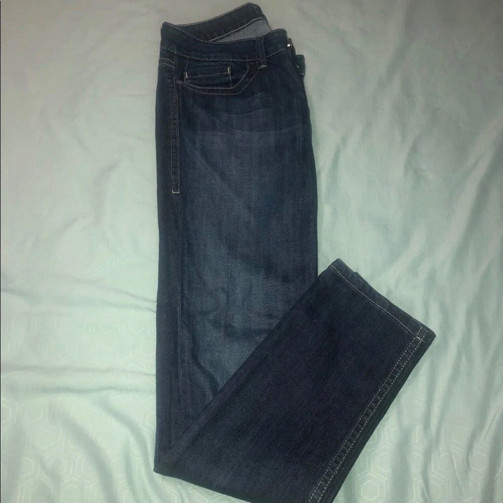 Dark boot cut jeans.